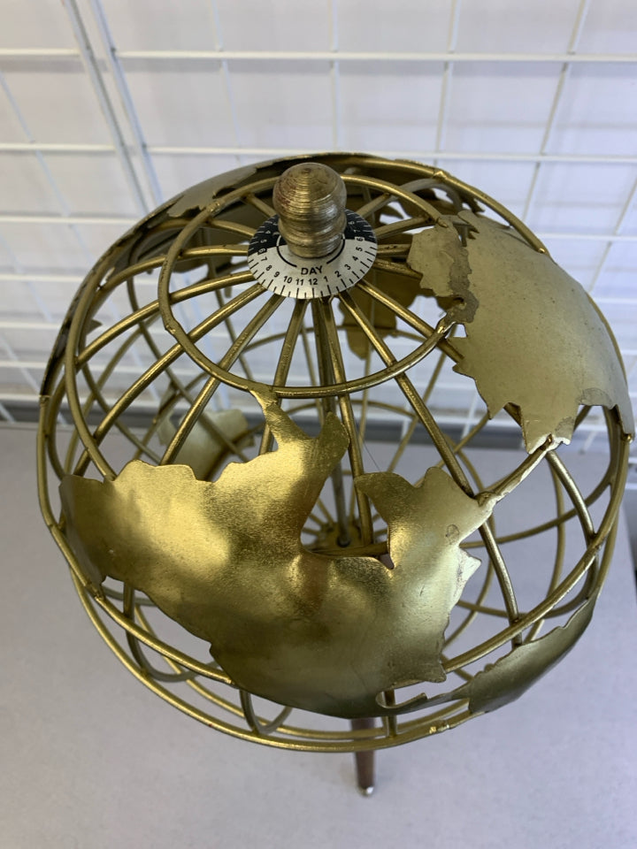 STANDING GOLD GLOBE ON WOODEN LEGS.