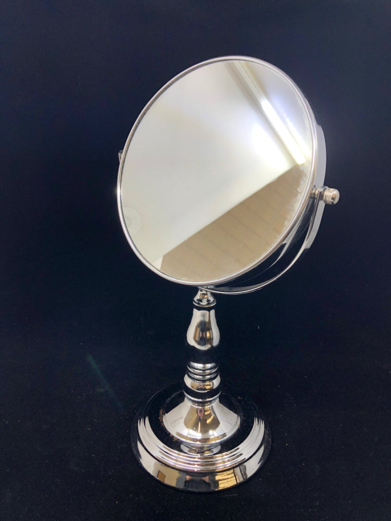SILVER VANITY MIRROR W/FLIP MAGNIFICATION.