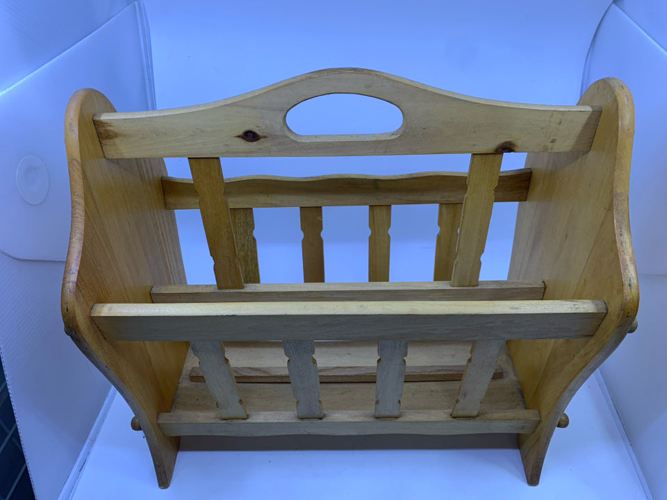 BLONDE FOOTED MAGAZINE RACK.