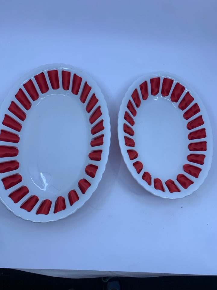 2 RED RIBBON OVAL NESTING BOWLS.