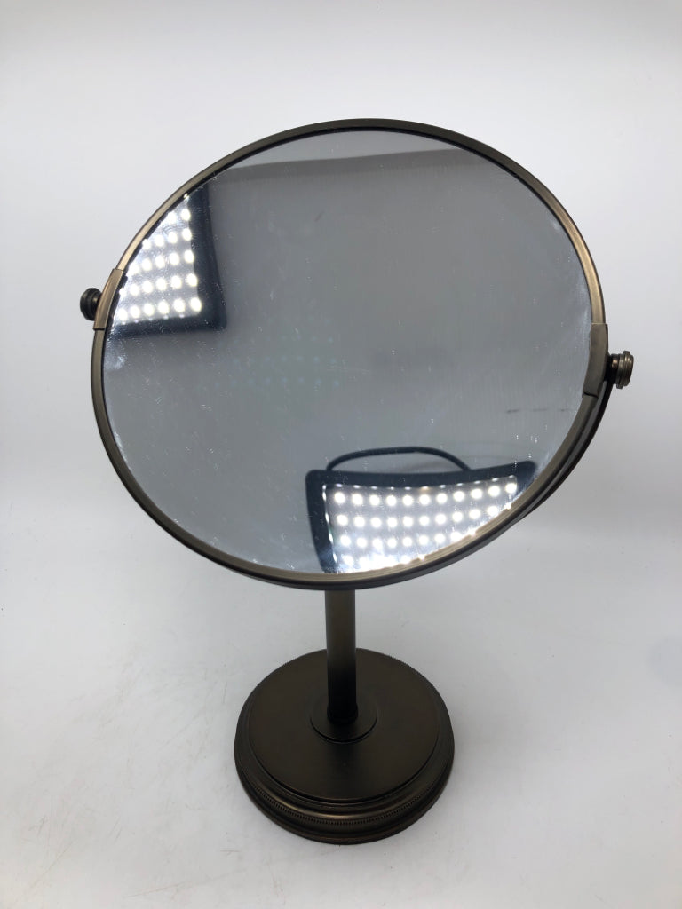 BRONZE COLORED FLIP-MIRROR.