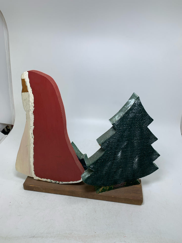 PRIMITIVE WOOD SANTA PULLING TREE.