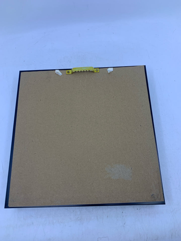 2 CHAIRS FACING WATER IN BLACK FRAME.