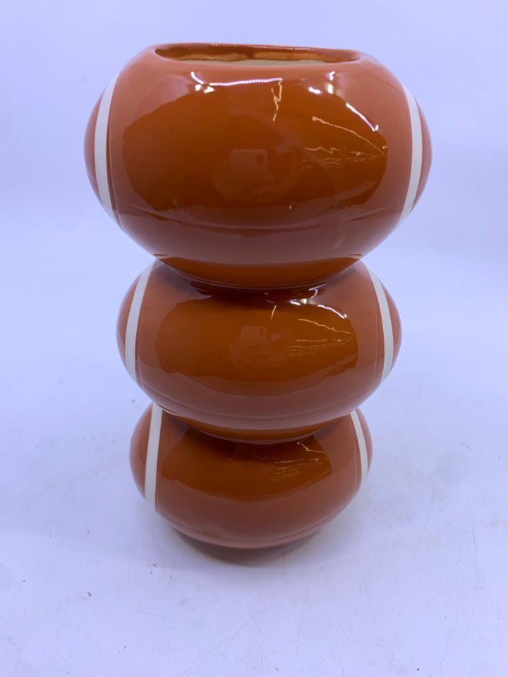 STACKED FOOTBALL CERAMIC VASE.