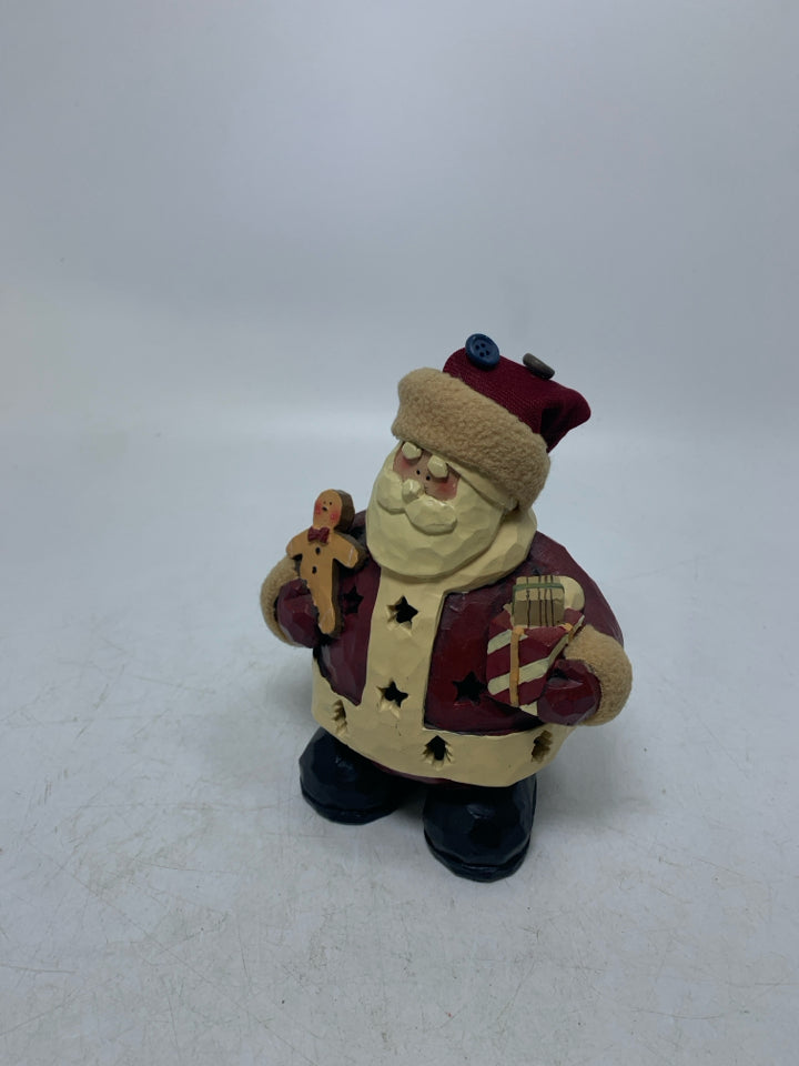 PRIMITIVE STYLE SANTA HOLDING PRESENT PIERCED TEA LIGHT HOLDER RESIN.