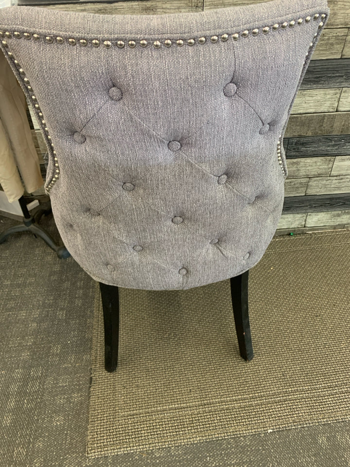DARK GREY ACCENT CHAIR W/ BLACK LEGS STUDDED EDGE.