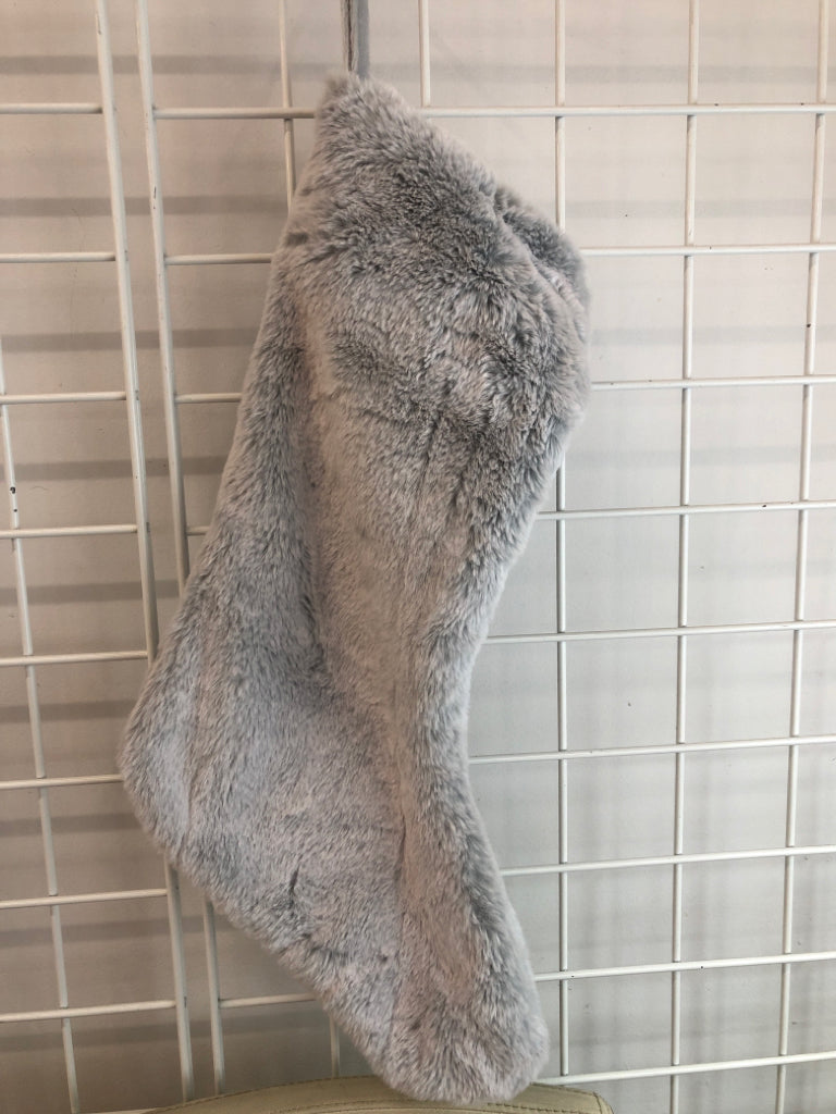 GRAY FLUFFY STOCKING W/ POM POMS.