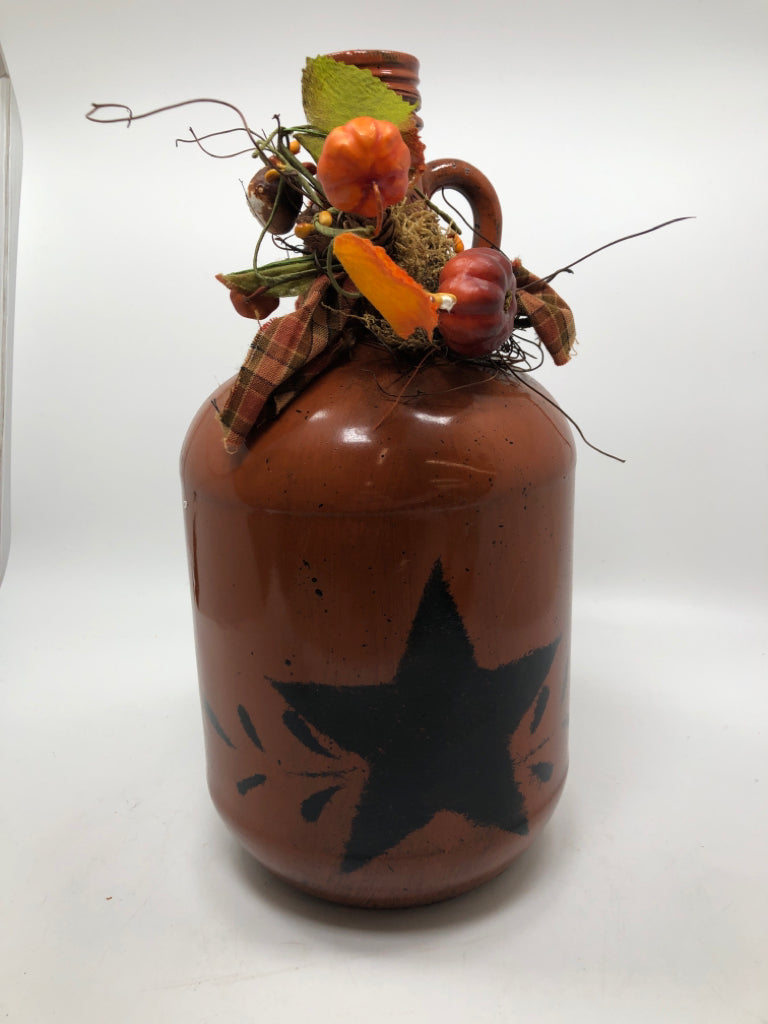 PRIMITIVE BROWN PAINTED GLASS JUG W/STAR AND PLAID BOW.