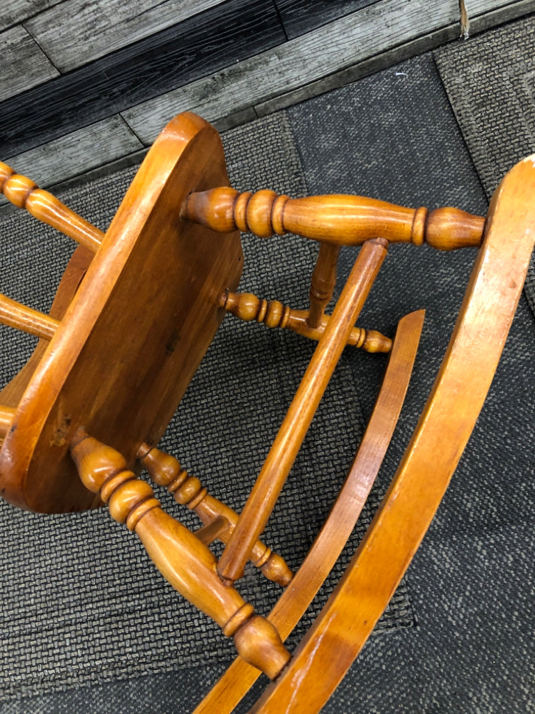 TAN CHILDRENS ROCKING CHAIR.