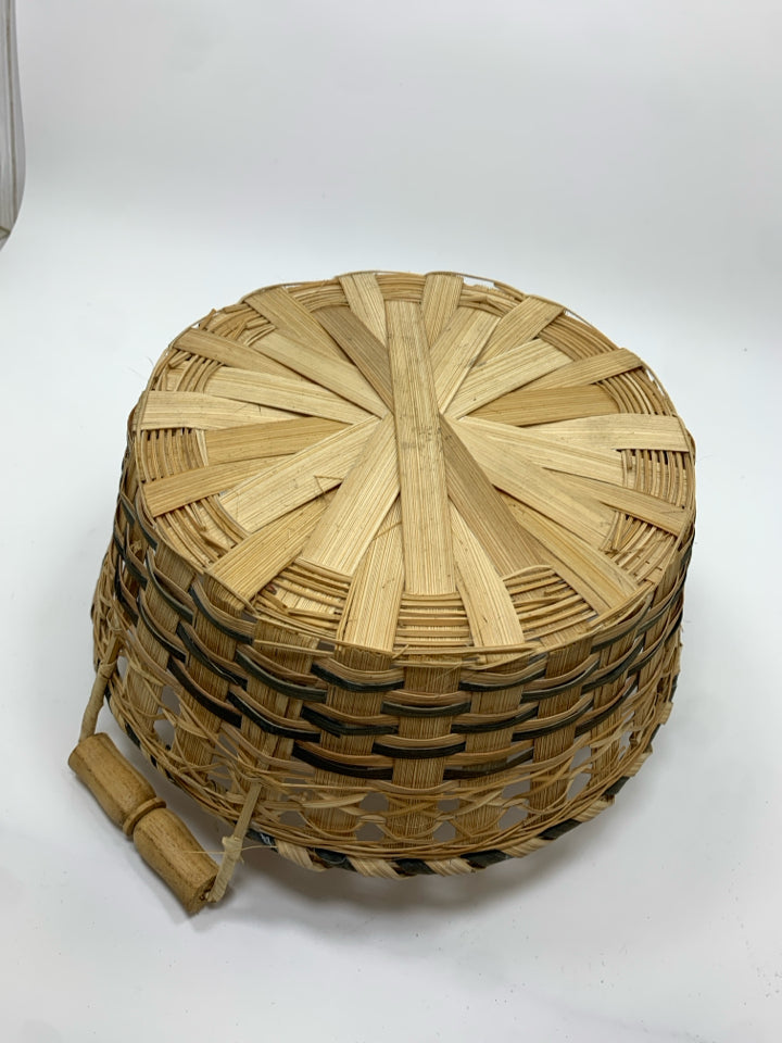 ROUND BLUE WOVEN BASKET W/HANDLES.