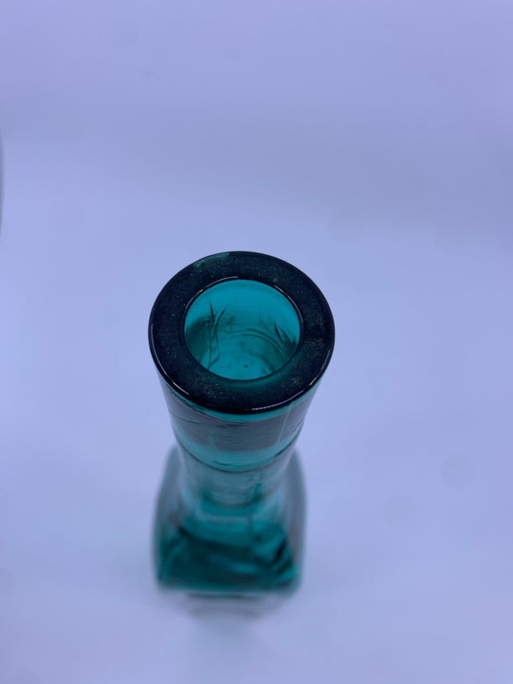 EMPTY TEAL GLASS DECORATIVE BOTTLE.