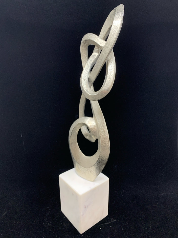 ABSTRACT METAL SCULPTURE ON MARBLE BASE.