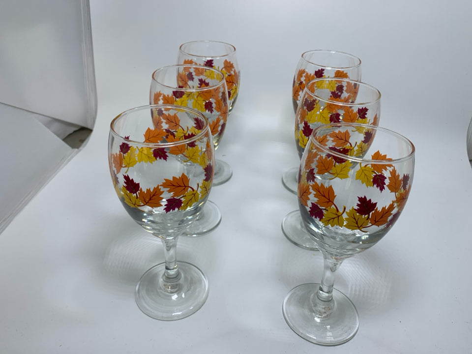 6 CLEAR WINE GLASSES W/ PRINTED FALL LEAVES.