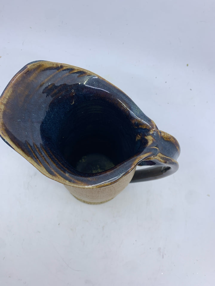 TAN/BROWN CERAMIC PITCHER.