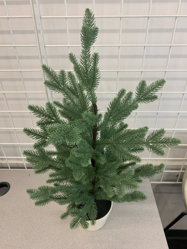 FAUX SPRUCE TREE IN WHITE POT.