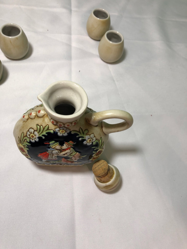 6PC SMALL GERMAN EMBOSSED PEOPLE GLASSES AND DECANTER.