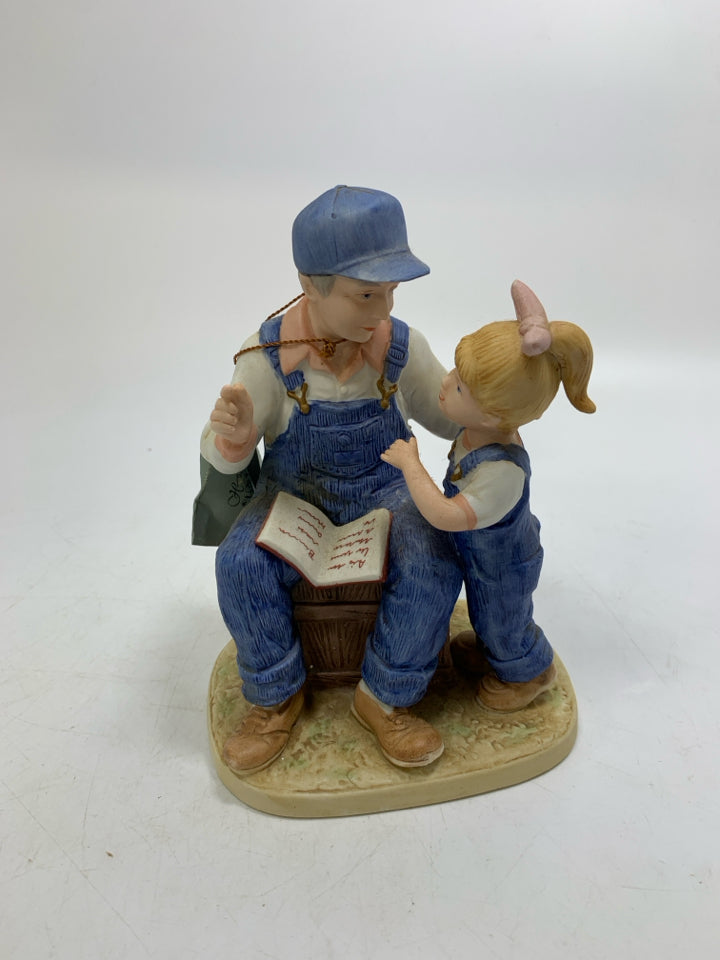 DENIM DAYS FATHER READING TO GIRL.