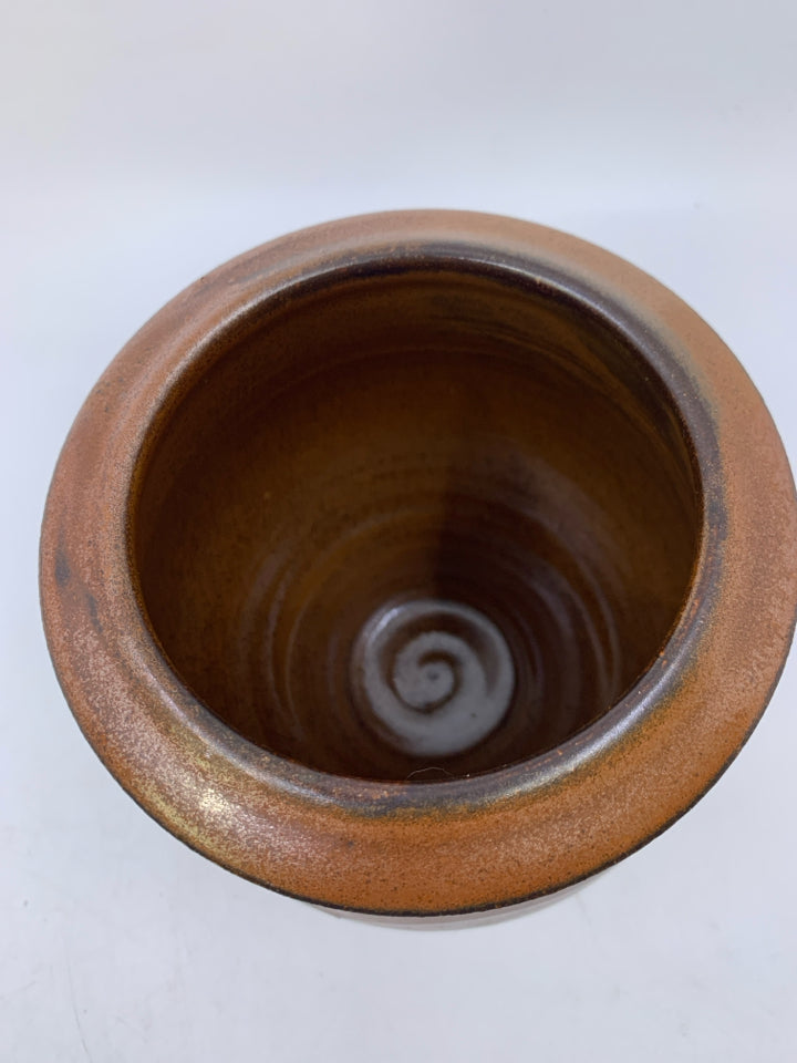 HEAVY RUST COLORED W/ WAVY CARVED LINES VASE.