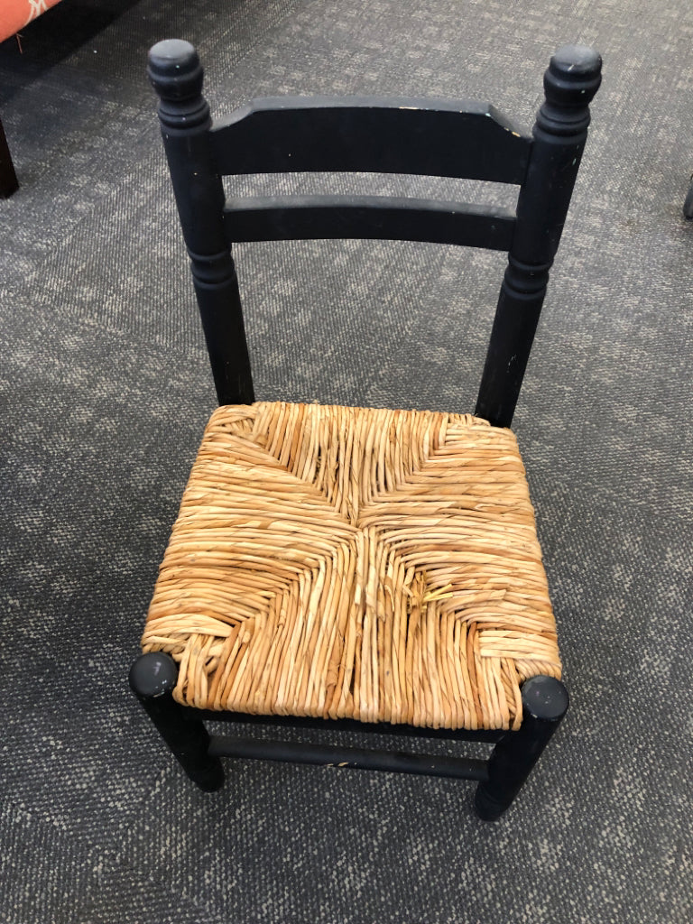 KIDS BLACK TABLE W/2 WICKER CHAIRS.