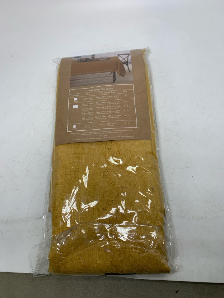 NIP YELLOW CUTWORK TABLECLOTH OBLONG.