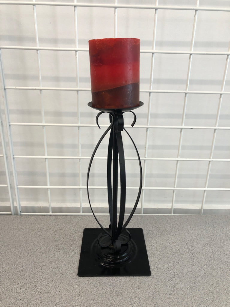 3 DECORATIVE CANDLE HOLDERS W/ORANGE TO RED CANDLES.