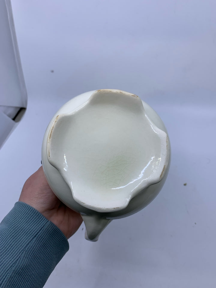 SMALL EMBOSSED PITCHER.