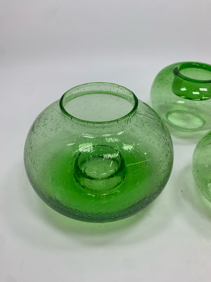 3 GREEN GLASS VOTIVE CANDLE HOLDERS.
