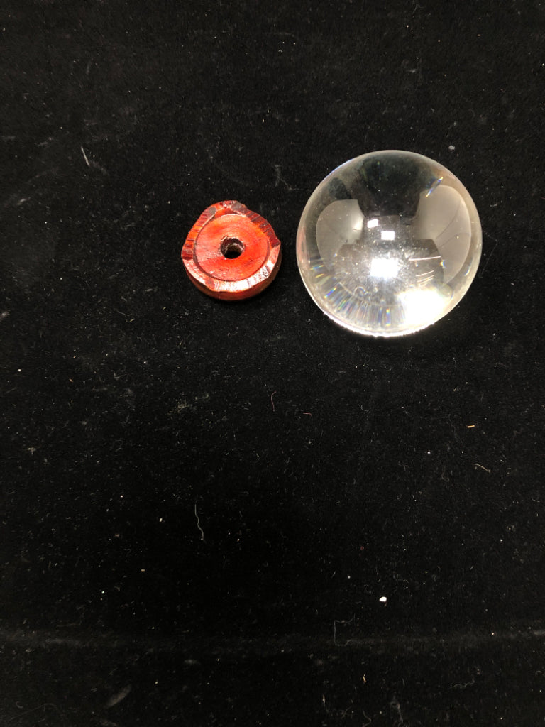 CLEAR GLASS ORB ON STAND.