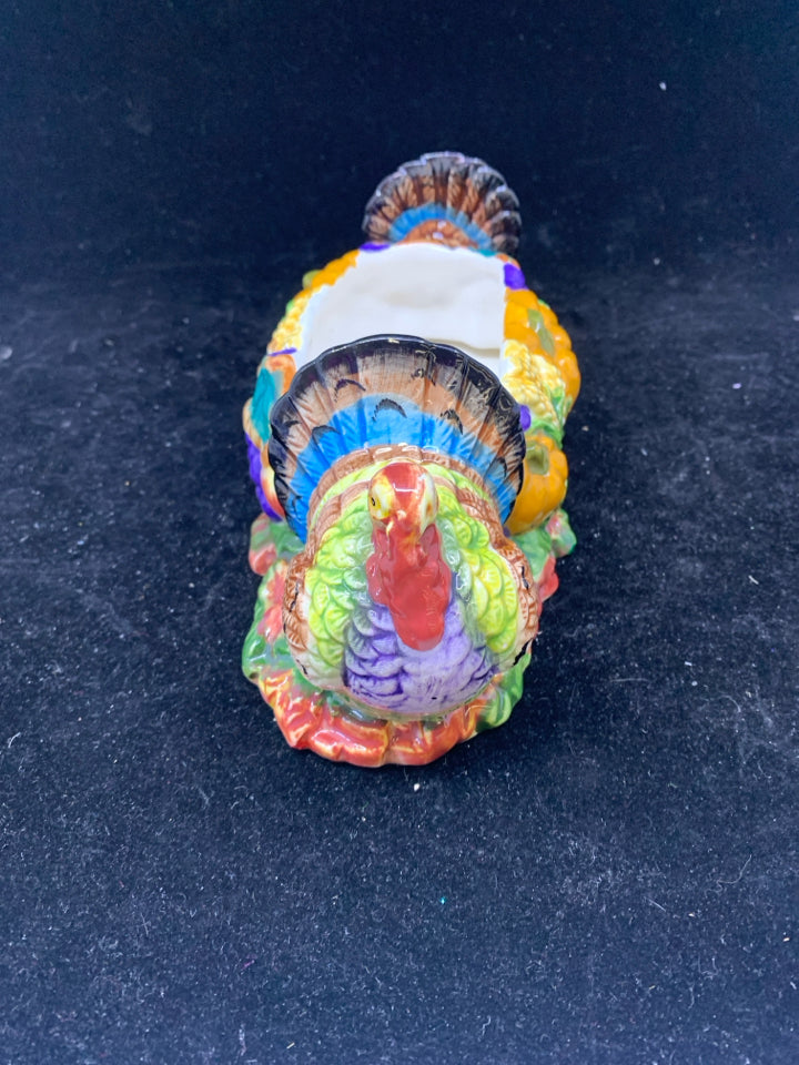 COLORFUL THANKSGIVING DISH W TURKEYS ON END.