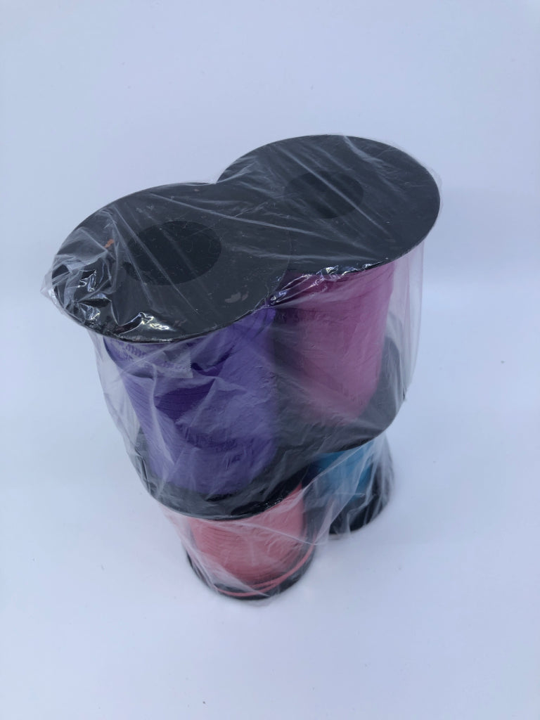 4 SPOOLS OF RIBBON PURPLE,PINK,BLUE,RED IN BAG.