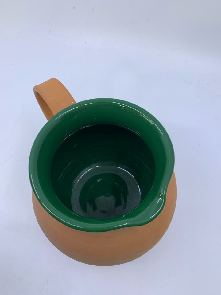 MATTER TERRA COTTA PITCHER W/ DARK GREEN GLAZED INSIDE.