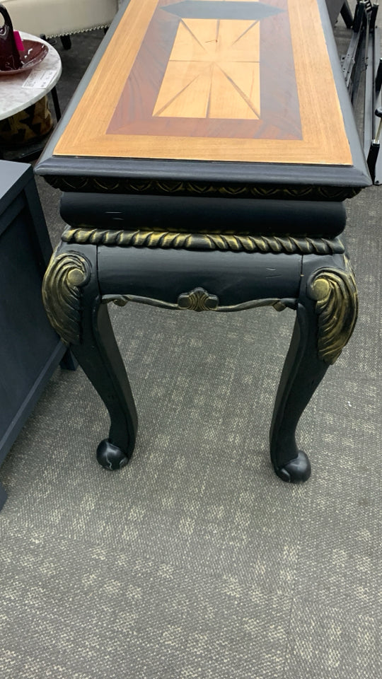 BLACK CONSOLE TABLE W/ TWO TONED STAINED INLAY.