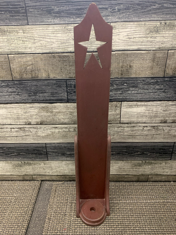 RED PRIMITIVE CANDLE HOLDER W STAR CUT OUT.