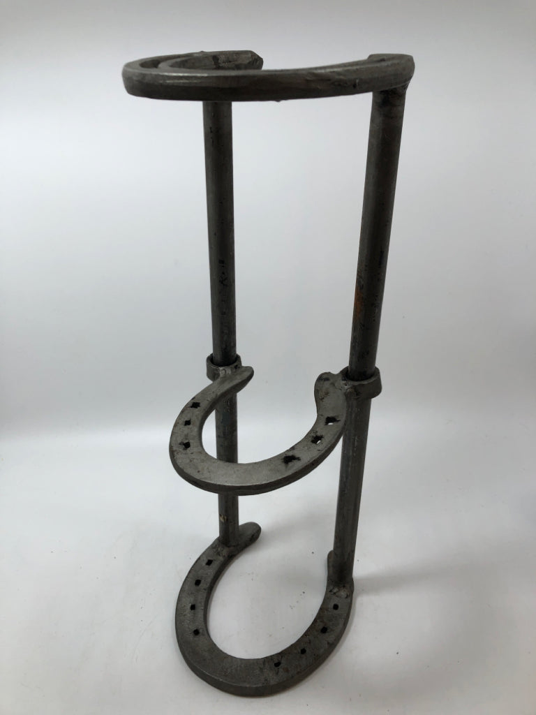 SLIDING HORSESHOE METAL BOOK HOLDER.