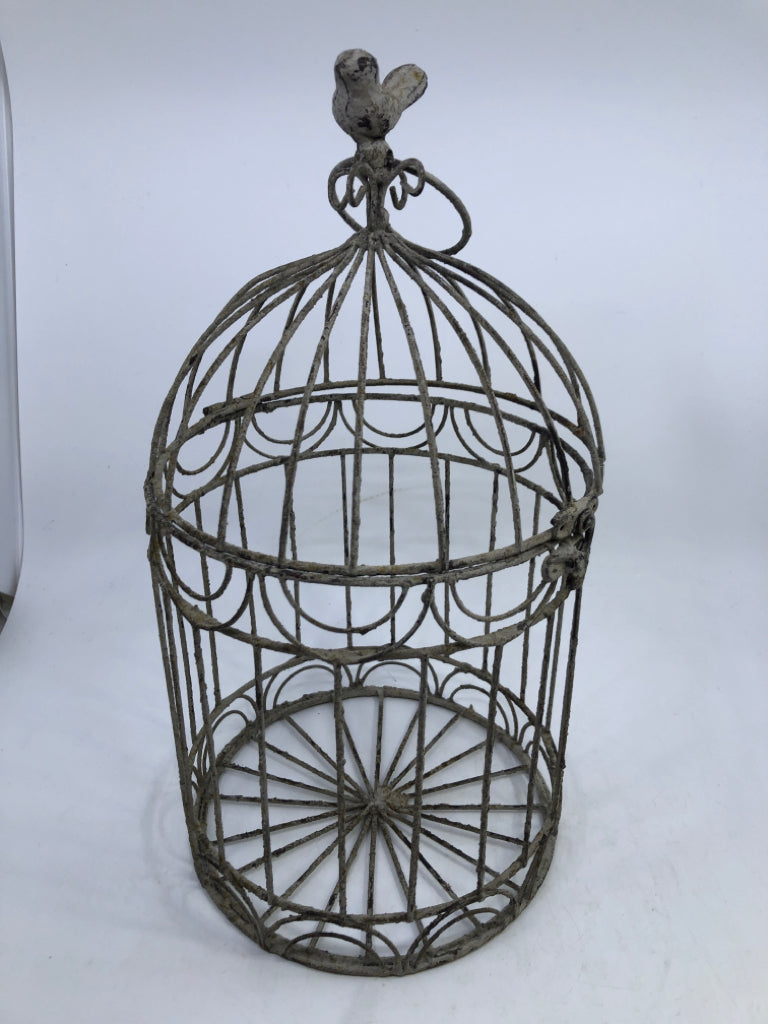 DISTRESSED METAL BIRD CAGE W/ BIRD ON TOP.