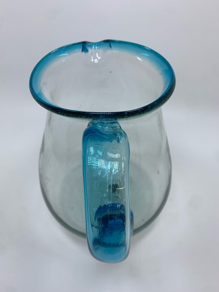 BLOWN GLASS PITCHER W/BLUE HANDLE.