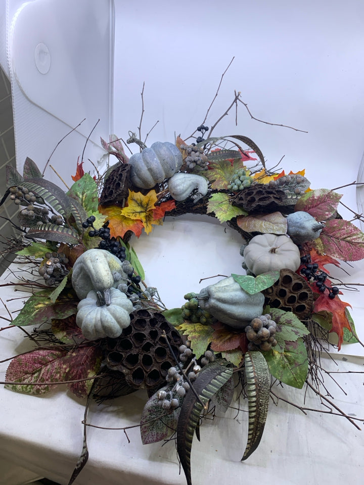 BLUE FAUX FLORAL TWIG WREATH.