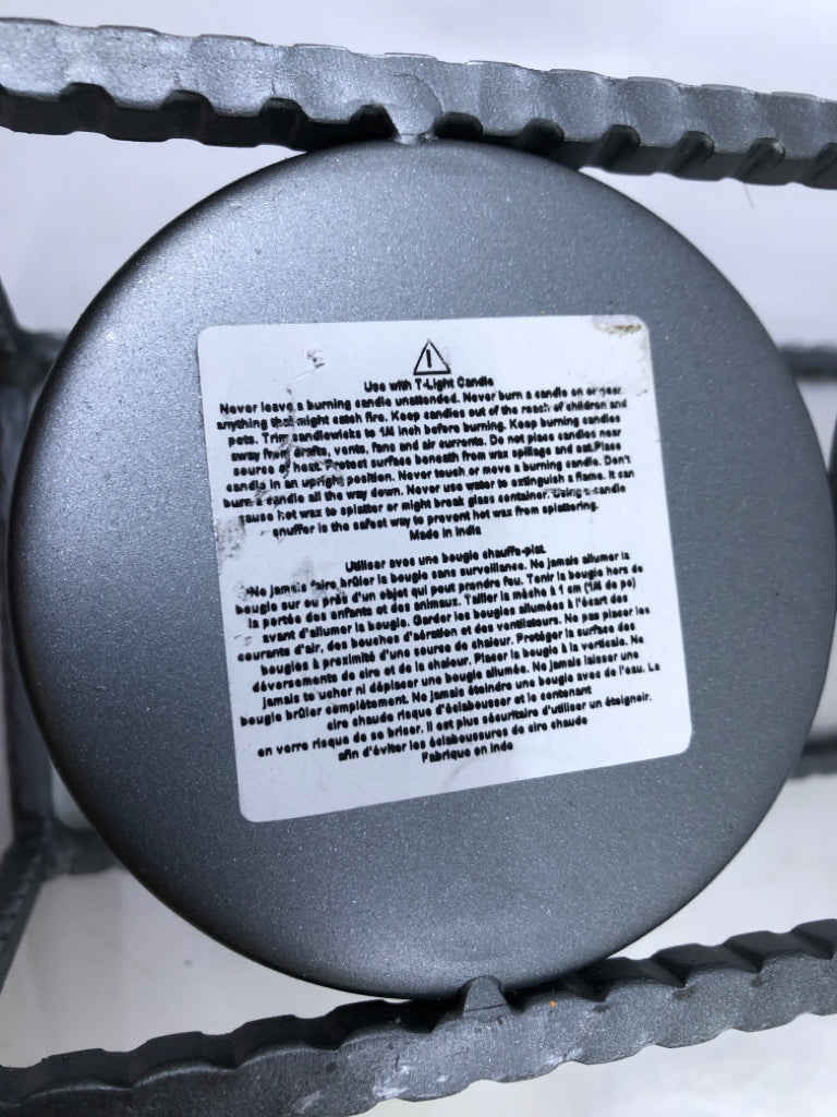 3 CANDLE HOLDERS IN METAL HOLDER.