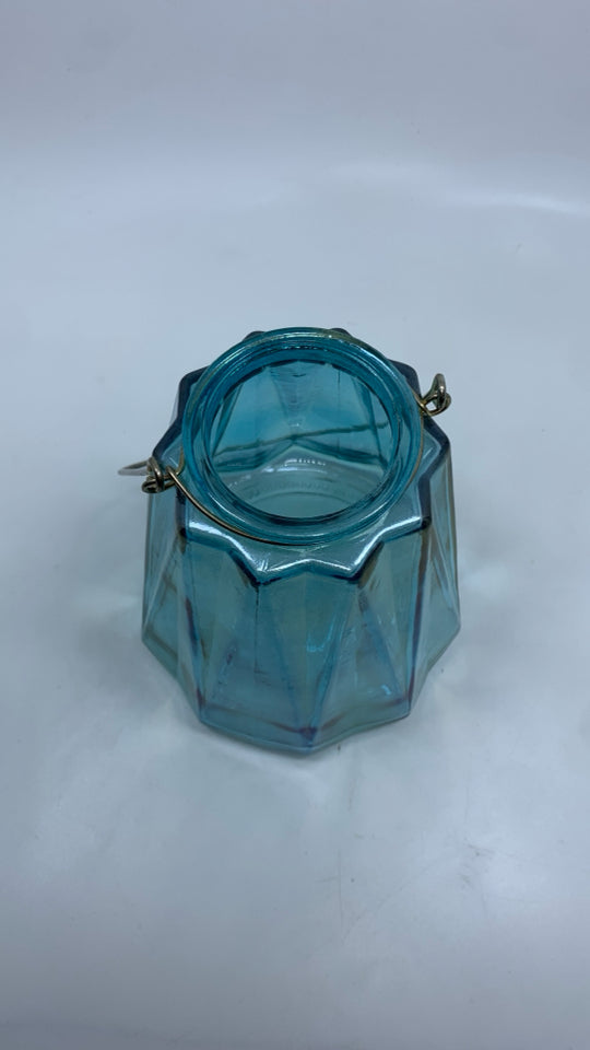 BLUE IRIDESCENT CANDLE HOLDER W/HANDLE.