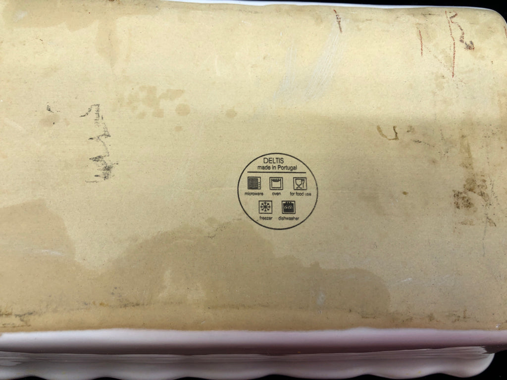 WHITE WAVY EDGE STONEWARE LOAF PAN.