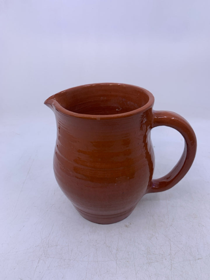 SMALL POTTERY PITCHER.