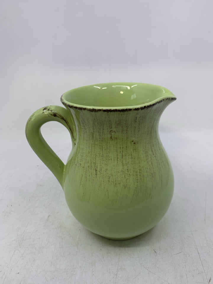 LIGHT GREEN DISTRESSED CERAMIC VASE.