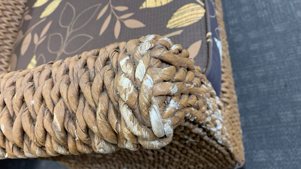 WICKER SOFA W/BROWN CUSHION.