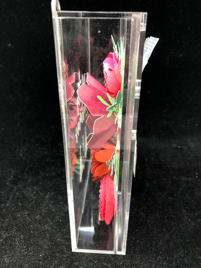 CLEAR PLASTIC SHADOW W/ ROLLING PAPER FLOWERS MERRY CHRISTMAS.