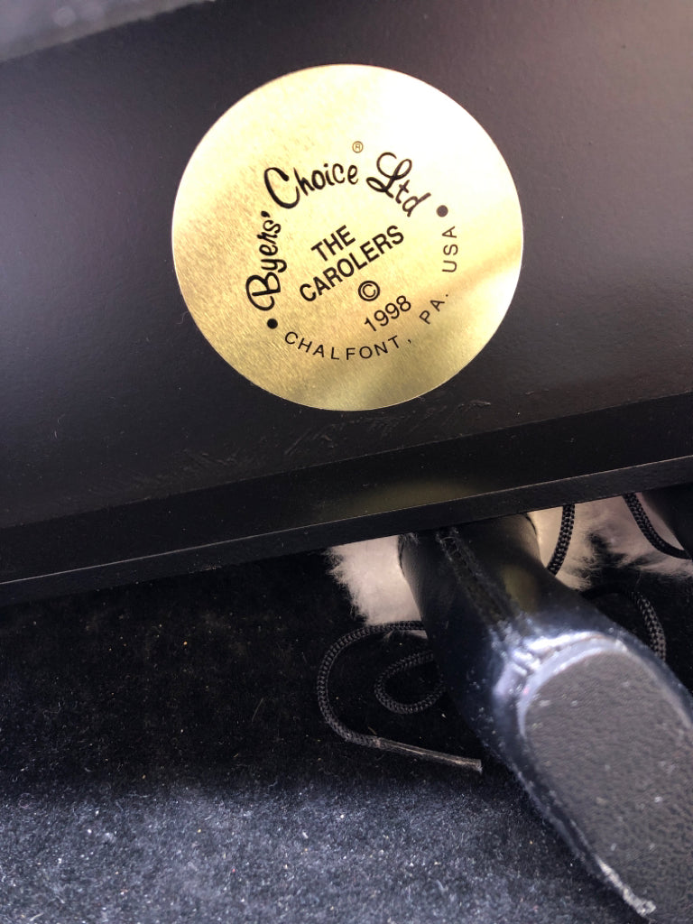 SANTA AND LITTLE BOY BYERS' CHOICE ON BENCH.