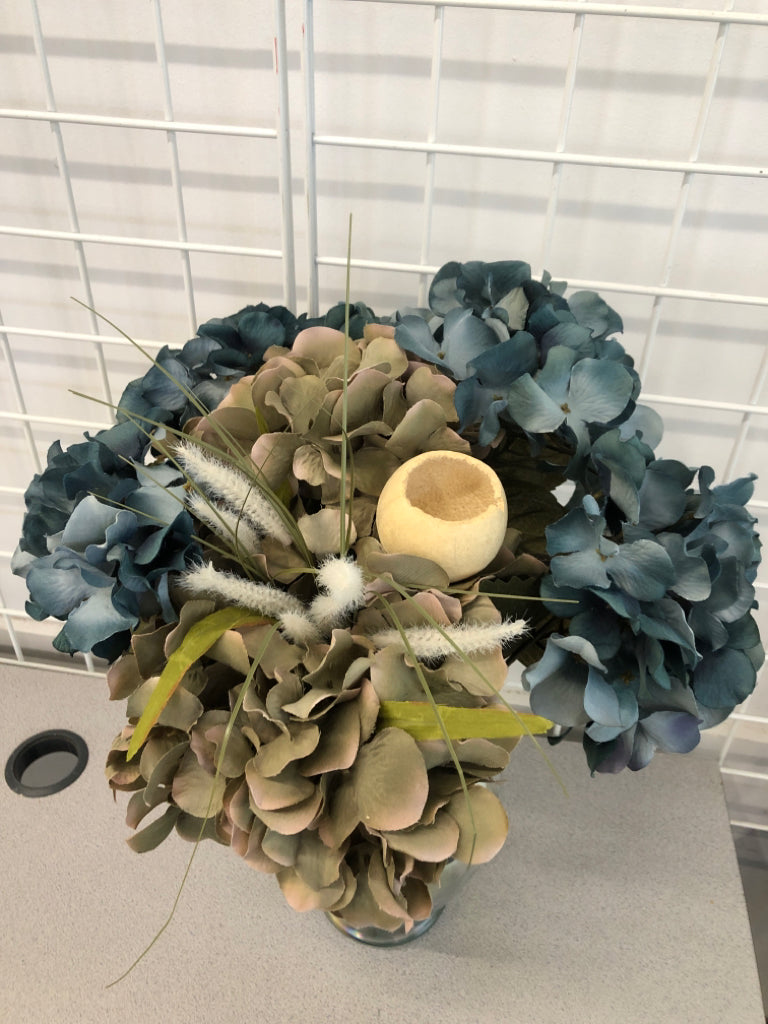 BLUE HYDRANGEA BOUQUET IN IRIDESCENT VASE.