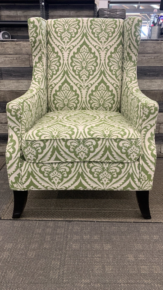 UPHOLSTERED GREEN PATTERNED ACCENT CHAIR.
