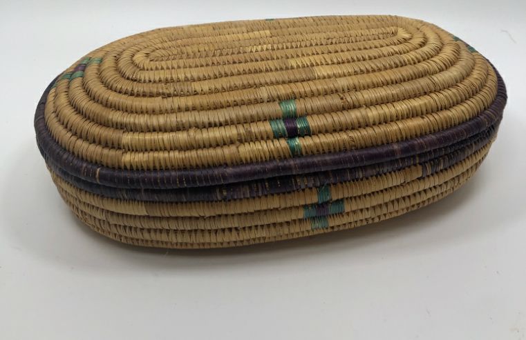 COLORFUL OVAL WOVEN BASKET W/LID.