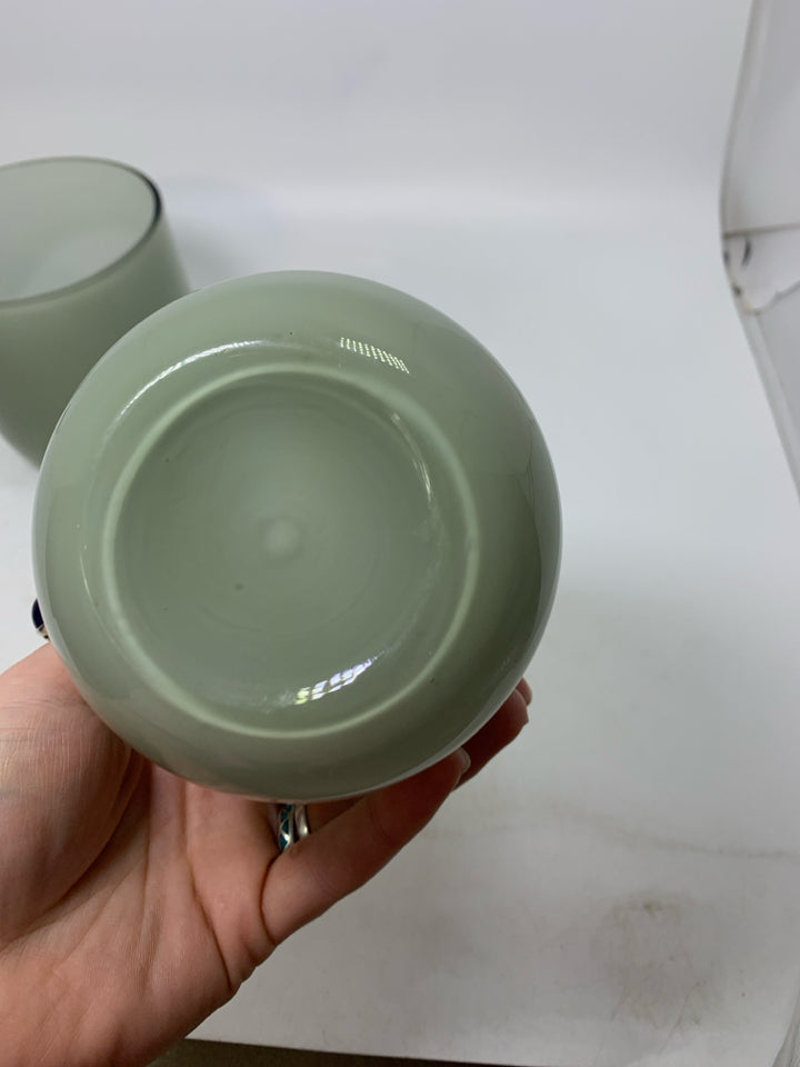 2 LIGHT GREY GLASS PLANTERS.
