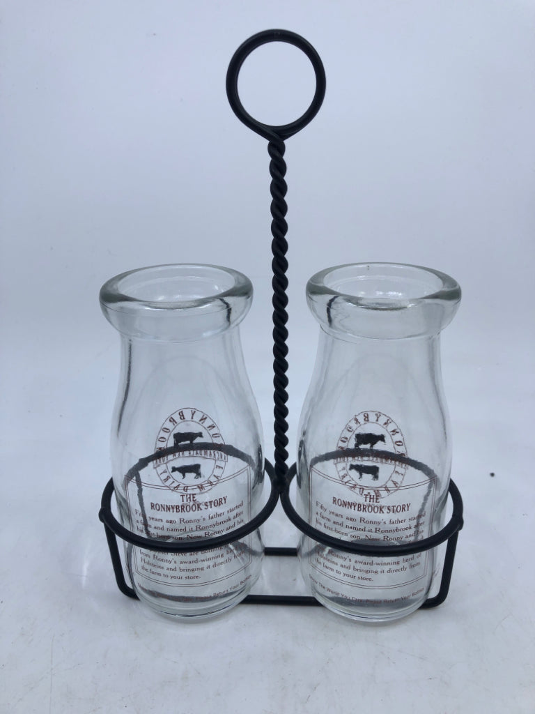3PC DAIRY GLASS BOTTLES IN METAL HOLDER.
